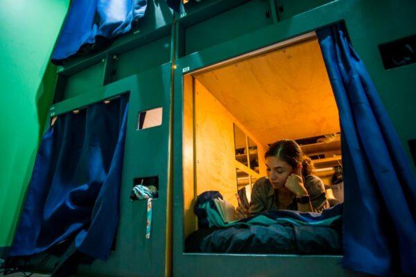 Kay Wilson is seen in her pod in the UP (st)ART house, a community for young people with artistic aspirations in need of an affordable place to live, in Los Angeles on Oct. 24, 2019. She packed up her life in a hurry and moved to Los Angeles ... only to find that what she paid in Pennsylvania for a nice studio apartment would only get her a 2.9-square-meter box in California. (Apu Gomes/AFP via Getty Images)