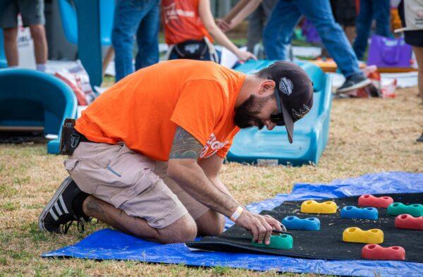 Volunteers work together in assembling Anaheim's newest playground in Anaheim, Calif., on Sept. 16, 2022. (John Fredricks/The Epoch Times)
