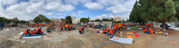 Volunteers work together in assembling Anaheim's newest playground in Anaheim, Calif., on Sept. 16, 2022. (John Fredricks/The Epoch Times)
