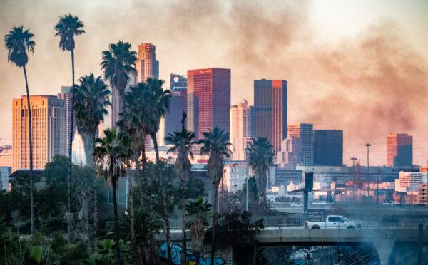 Arson within a homeless encampment creates smoke from fires in Los Angeles, Calif., on Jan. 2, 2022. (John Fredricks/The Epoch Times)