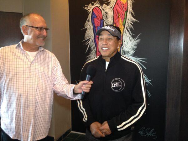 Tom Johnson (L) interviews singer-songwriter Smokey Robinson in an undated photo. (Courtesy of Tom Johnson)