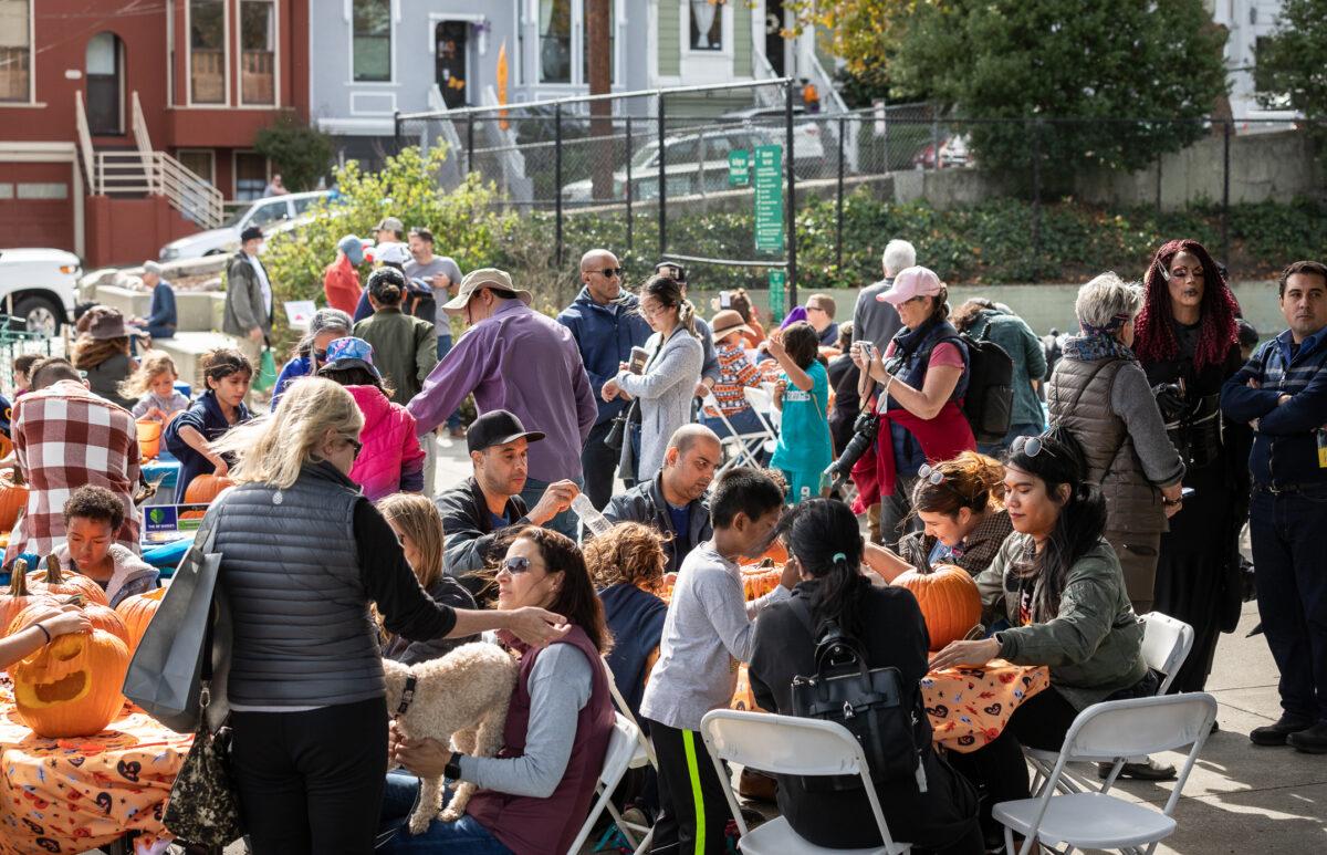 San Francisco residents carve pumpkins with state Sen. Scott Wiener and drag queen judges in San Francisco on Oct. 22, 2022. (John Fredricks/The Epoch Times)