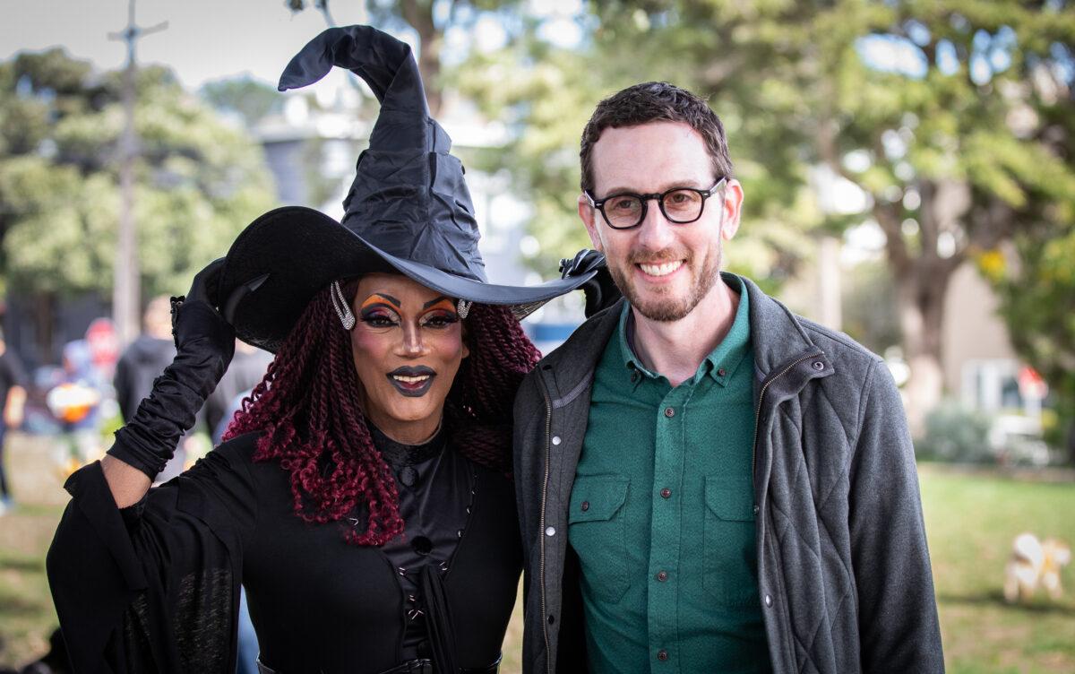 California state Sen. Scott Wiener, a Democrat, takes a photo with a drag queen in San Francisco on Oct. 22, 2022. (John Fredricks/The Epoch Times)
