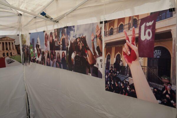 Images displayed at the "Woman, Life, Freedom" art exhibit at the Holiday Faire at Great Park in Irvine, Calif., on Nov. 5, 2022. (Rudy Blalock/The Epoch Times)