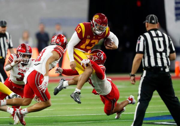 Southern California quarterback Caleb Williams (13) is tackled by Utah safeties R.J. Hubert (11) and Cole Bishop (8) during the first half of the Pac-12 Conference championship NCAA college football game in Las Vegas on Dec. 2, 2022. (Steve Marcus/AP Photo)