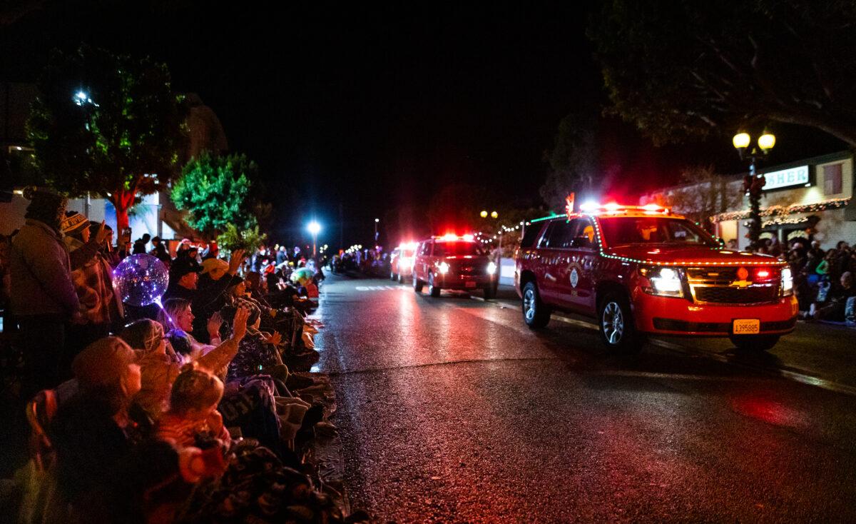 People enjoy the Seal Beach Christmas Parade in Seal Beach, Calif., on Dec. 2, 2022. (John Fredricks/The Epoch Times)