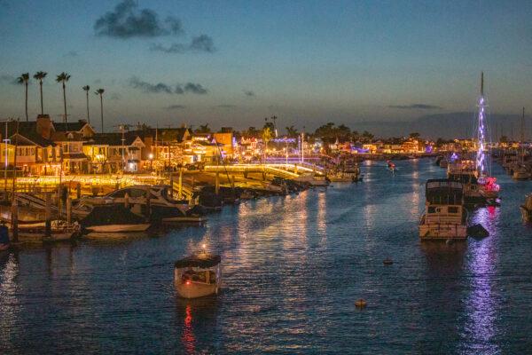 Boats show off Christmas decorations in Newport Harbor, Newport Beach, Calif., on Dec. 17, 2020. (John Fredricks/The Epoch Times)
