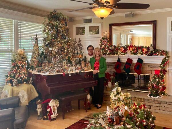 Sylvia Nash and Loren Lillestrand showcase their elaborately decorated home with 85 Christmas trees, thousands of twinkling lights, 300 Santa Clauses, among other elements in Chino Hills, Calif., on Dec. 16, 2022. (Carol Cassis/The Epoch Times)