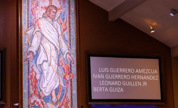 A mosaic depiticting Jesus Christ overlooks the names of homeless individuals died in Orange County over the past year at the Lutheran Church of the Cross in Laguna Woods, Calif., on Dec. 21, 2022. (John Fredricks/The Epoch Times)