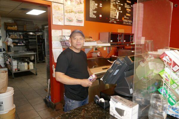 Manager Sam Eng sees business almost as usual at Donut Den in Santa Clara, Calif., on Jan. 10, 2023. (Steve Ispas/The Epoch Times)