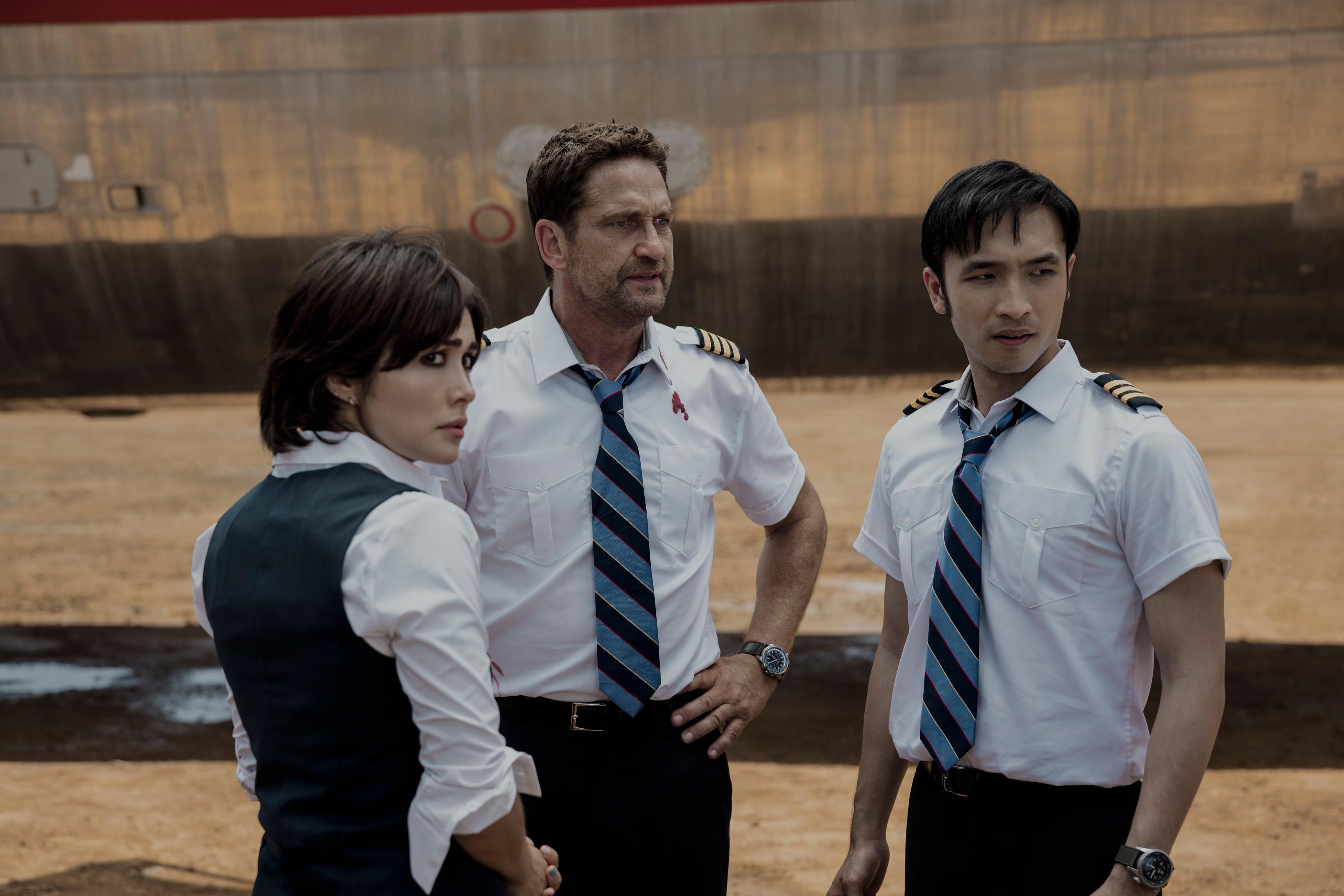 (L–R) Bonnie (Daniella Pineda), Captain Brodie Torrance (Gerard Butler) and Dele (Yoson An), in a scene from "Plane." (Kenneth Rexach/Lionsgate)