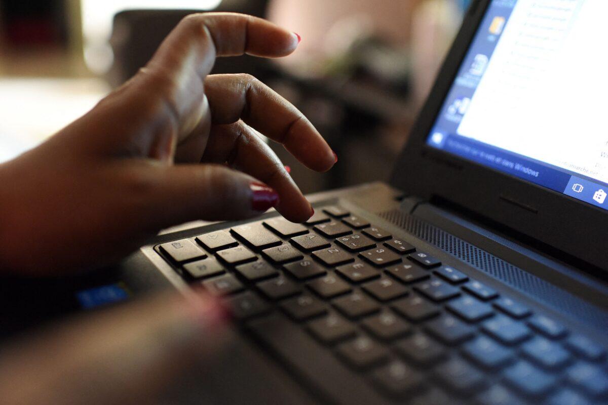 A woman uses a laptop in a file photo. (Issouf Sanogo/AFP via Getty Images)