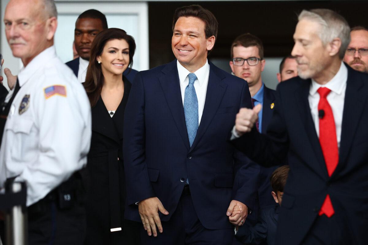 Florida Governor Ron DeSantis (C) enters with his wife Casey (2nd-L) before speaking about his new book "The Courage to Be Free" in the Air Force One Pavilion at the Ronald Reagan Presidential Library in Simi Valley, Calif., on March 5, 2023. (Mario Tama/Getty Images)
