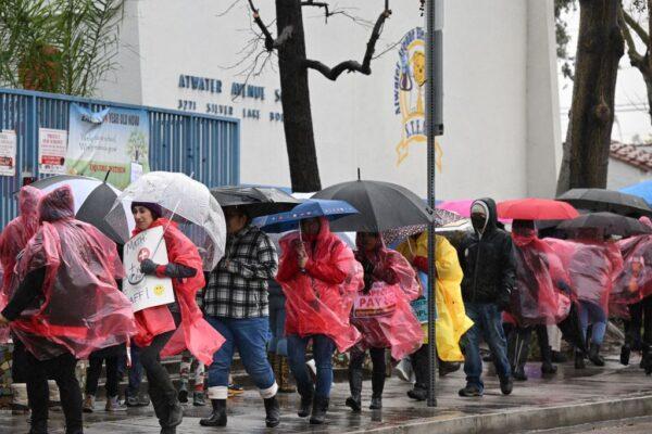 Los Angeles public school support workers, teachers, parents, and students walk the picket line in front of an elementary school on the first day of a teachers' strike in Los Angeles on March 21, 2023 (Robyn Beck/via Getty Images)