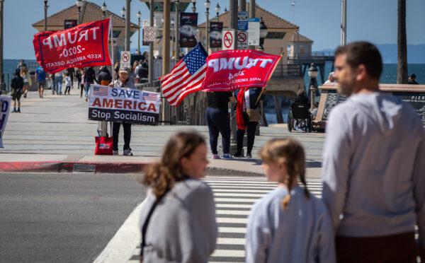 Supporters of former President Donald Trump gather at the Huntington Beach Pier in Huntington Beach, Calif., on April 4, 2023. (John Fredricks/The Epoch Times)