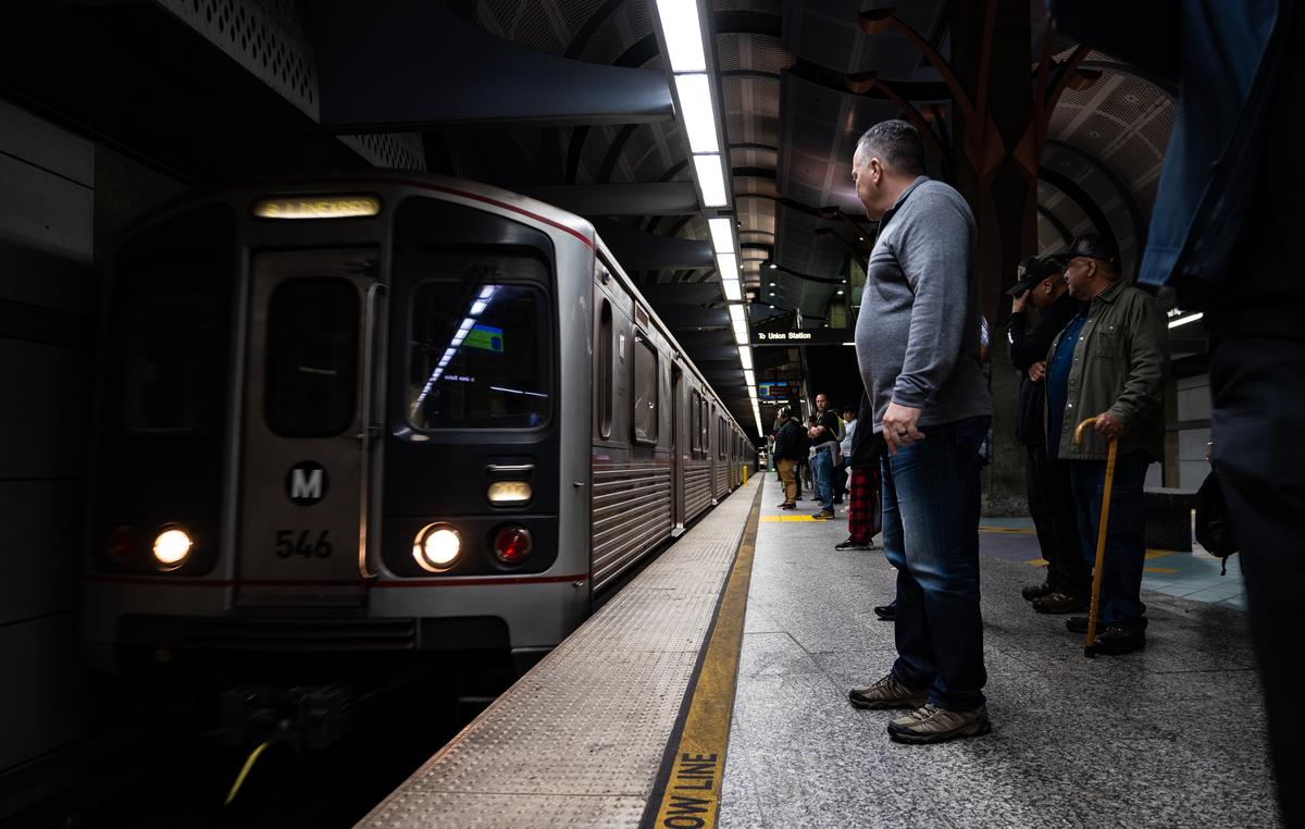 Former Los Angeles Sheriff Alex Villanueva (C) uses the Los Angeles Metro system in Los Angeles on April 19, 2023. (John Fredricks/The Epoch Times)