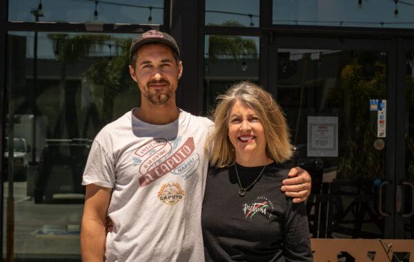 Pietrini Pizza Owner Blair Pietrini and son Head Pizza Chef Landon Pietrini stand at Pietrini Pizza in Los Alamitos, Calif., on April 20, 2023. (John Fredricks/The Epoch Times)