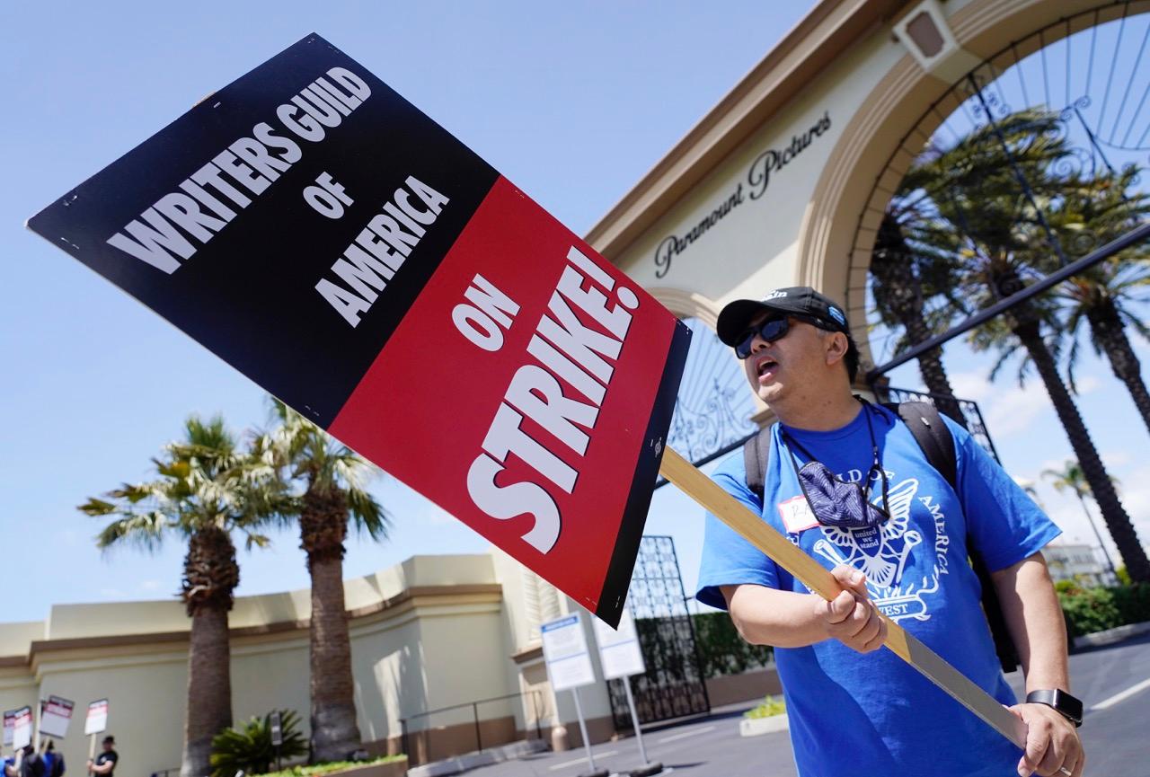 Ray Utarnachitt, a captain in the Writers Guild of America West, pickets with others at an entrance to Paramount Pictures in Los Angeles on May 2, 2023. (Chris Pizzello/AP Photo)