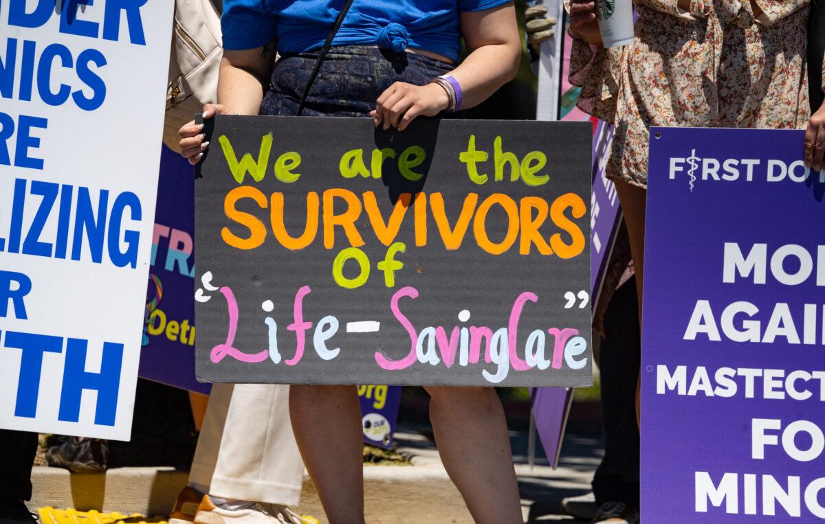 Detransition advocates meet outside of the annual Pediatric Endocrine Society conference held in San Diego, Calif., on May 6, 2023. (John Fredricks/The Epoch Times)