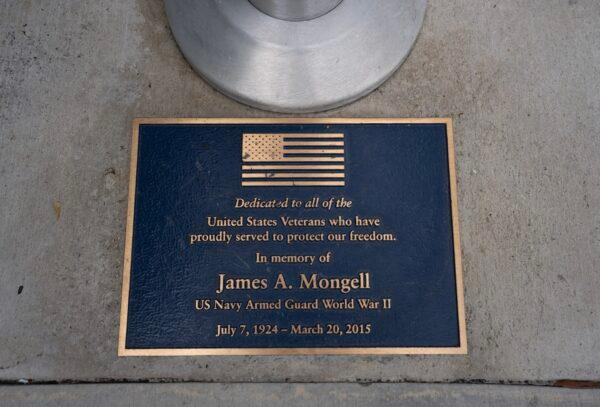 A placard in front of the United States flag pole at the Tustin Veterans Outpost, a facility run by the Christian-based nonprofit Orange County Rescue Mission in Tustin, Calif., on May 25, 2023. (Rudy Blalock/The Epoch Times)