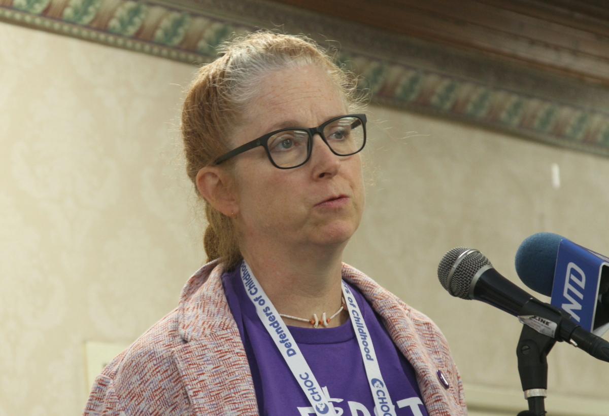 Dr. Julia Mason speaks at the First Do No Harm rally against transgender medical interventions in youth in Anaheim, Calif., on Oct. 8, 2022. (Brad Jones/The Epoch Times)