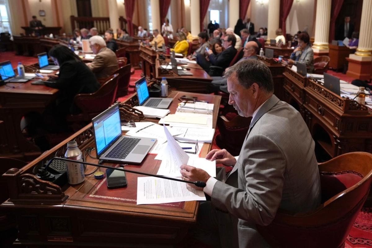 State Sen. Brian Dahle, a Republican, works at his desk as legislators work on the state budget at the Capitol in Sacramento, Calif., on June 27, 2023. (Rich Pedroncelli/AP Photo)