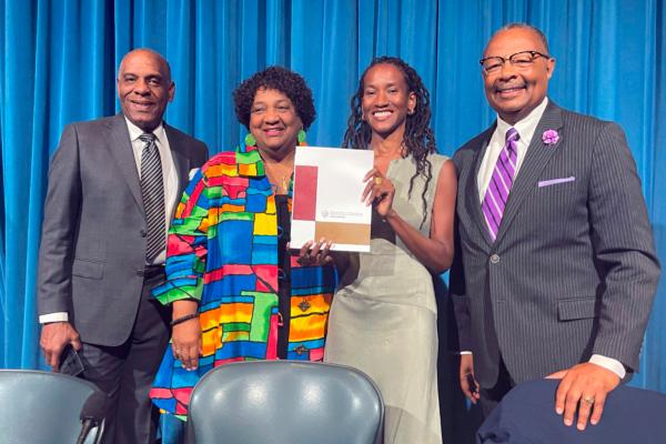 (L-R) State Sen. Steven Bradford, Secretary of State Shirley Weber, task force member Lisa Holder, and Assemblyman Reggie Jones-Sawyer hold up a final report of the California Task Force to Study and Develop Reparation Proposals for African Americans during a hearing in Sacramento, Calif., on June 29, 2023. (Haven Daley/AP Photo)