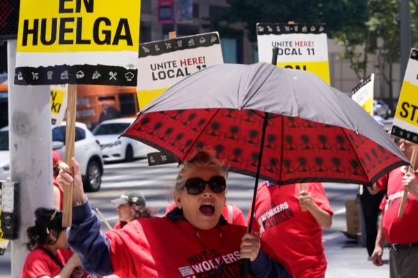 Striking hotel workers rally outside the InterContinental Los Angeles Downtown Hotel in downtown Los Angeles on July 4, 2023. (Damian Dovarganes/AP Photo)