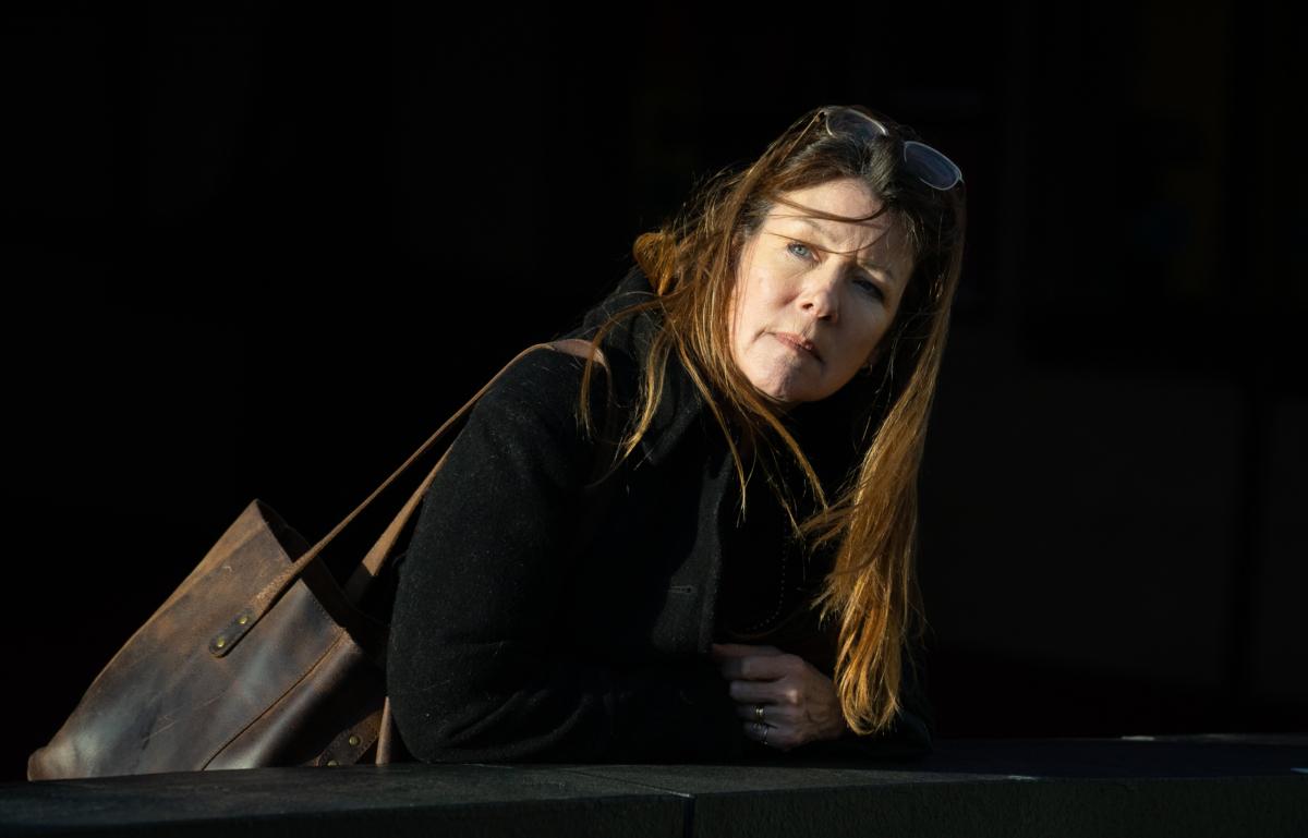 Jacqui Berlinn looks for her son Corey who is homeless and addicted to fentanyl in San Francisco, Calif., on Feb. 22, 2023. (John Fredricks/The Epoch Times)