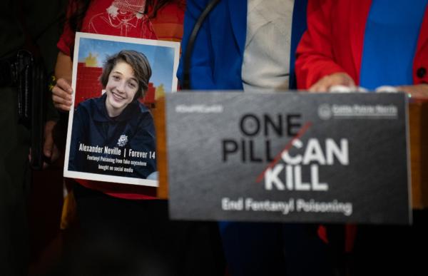 A photo of 14 year old Alexander Neville who died after accidentally taking fentanyl is held in Irvine, Calif., on April 28, 2023. (John Fredricks/The Epoch Times)