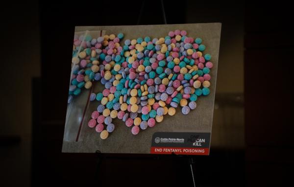 A poster of candy-like fentanyl sits in Irvine, Calif., on April 28, 2023. (John Fredricks/The Epoch Times)