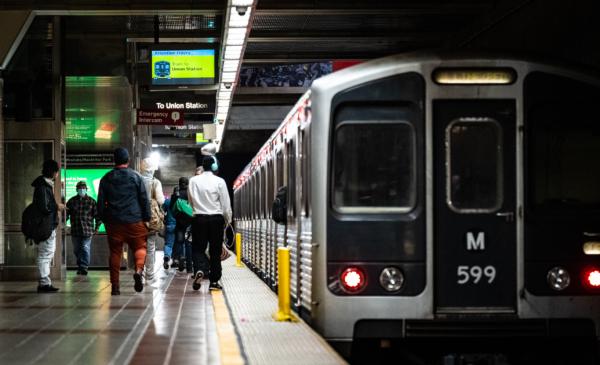 Passengers walk in the Westlake/Macarthur Park train station in Los Angeles on March 20, 2023. (John Fredricks/The Epoch Times)