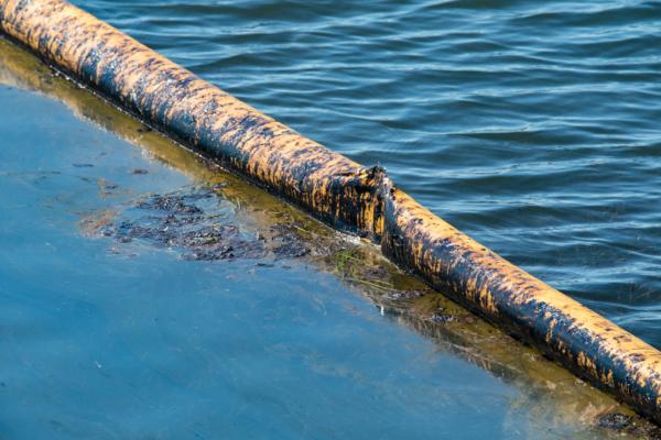 Clean up efforts are underway in Huntington Beach, Calif., to clean a massive oil spill the struck the coastline on Oct. 3, 2021. Oct. 5, 2021. (John Fredricks/The EPoch Times)