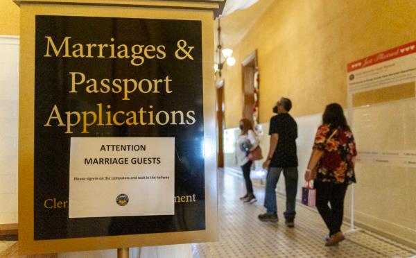 Couples arrange for Valentine's Day courthouse wedding services at the Old Orange County Courthouse in Santa Ana, Calif., on Feb. 14, 2022. (John Fredricks/The Epoch Times)