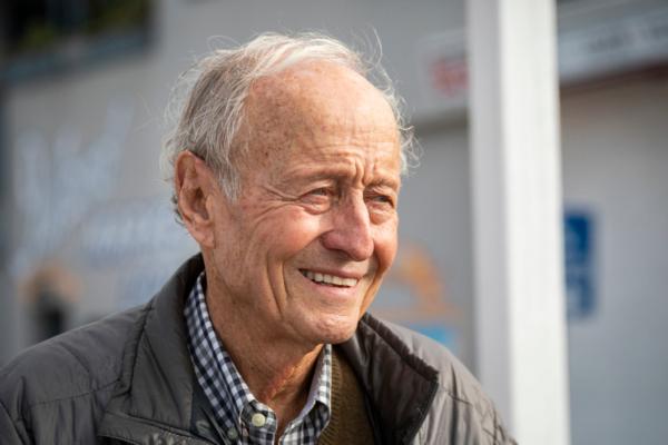 Ferry owner and Balboa Island resident Seymour Beek watches people ride the boats across the harbor on Dec. 29, 2021. (John Fredricks/The Epoch Times)