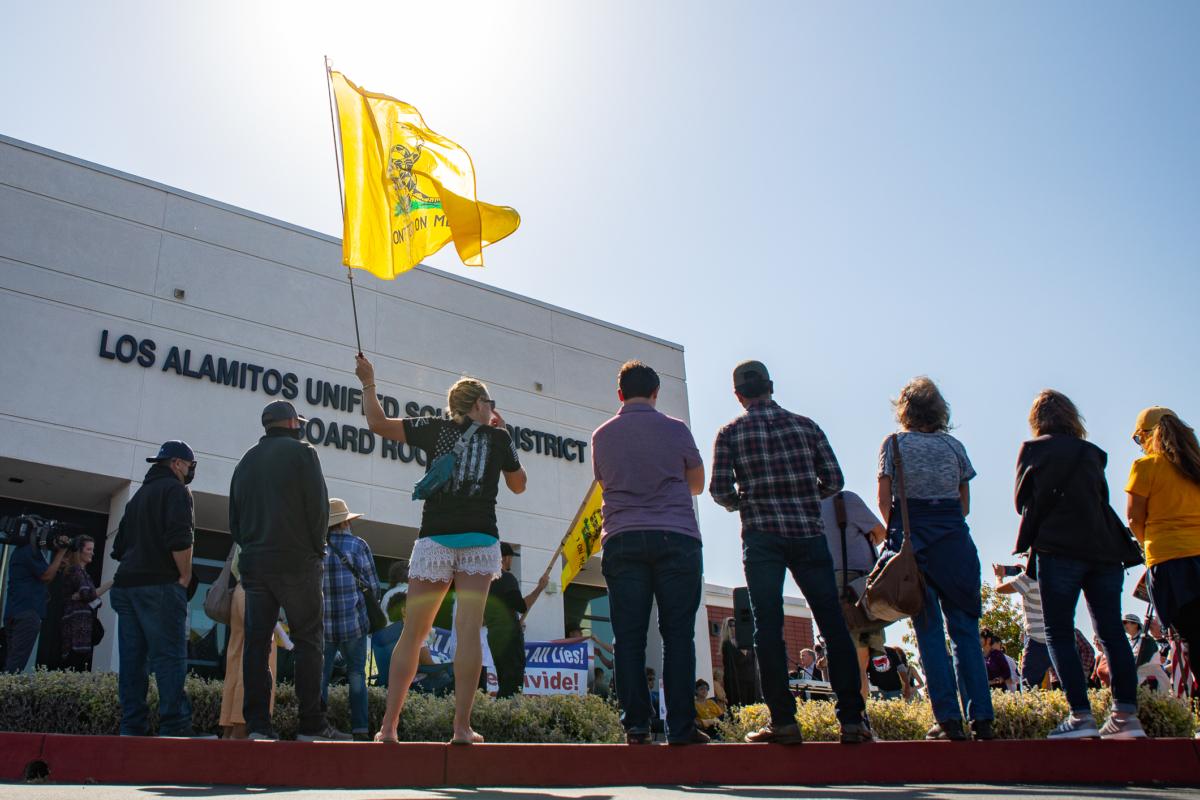 Demonstrators gather in front of Los Alamitos Unified School District Headquarters in protest of critical race theory teachings in Los Alamitos, Calif., on May 11, 2021. (John Fredricks/The Epoch Times)