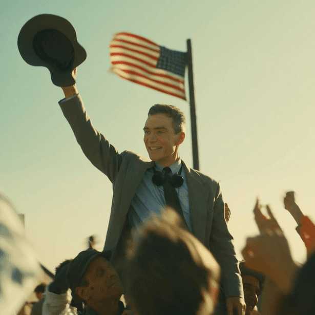Physicist J.R. Oppenheimer (Cillian Murphy) celebrated as a war hero, in "Oppenheimer." (Universal Pictures)
