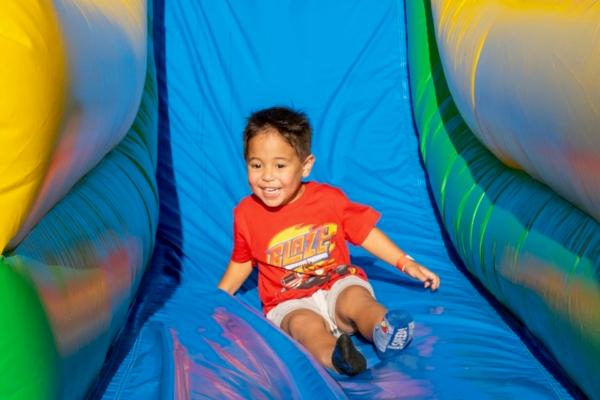 A child plays on the inflatable slides at Irvine Nights at Orange County Great Park in Irvine, Calif. (Courtesy of PSQ Productions)
