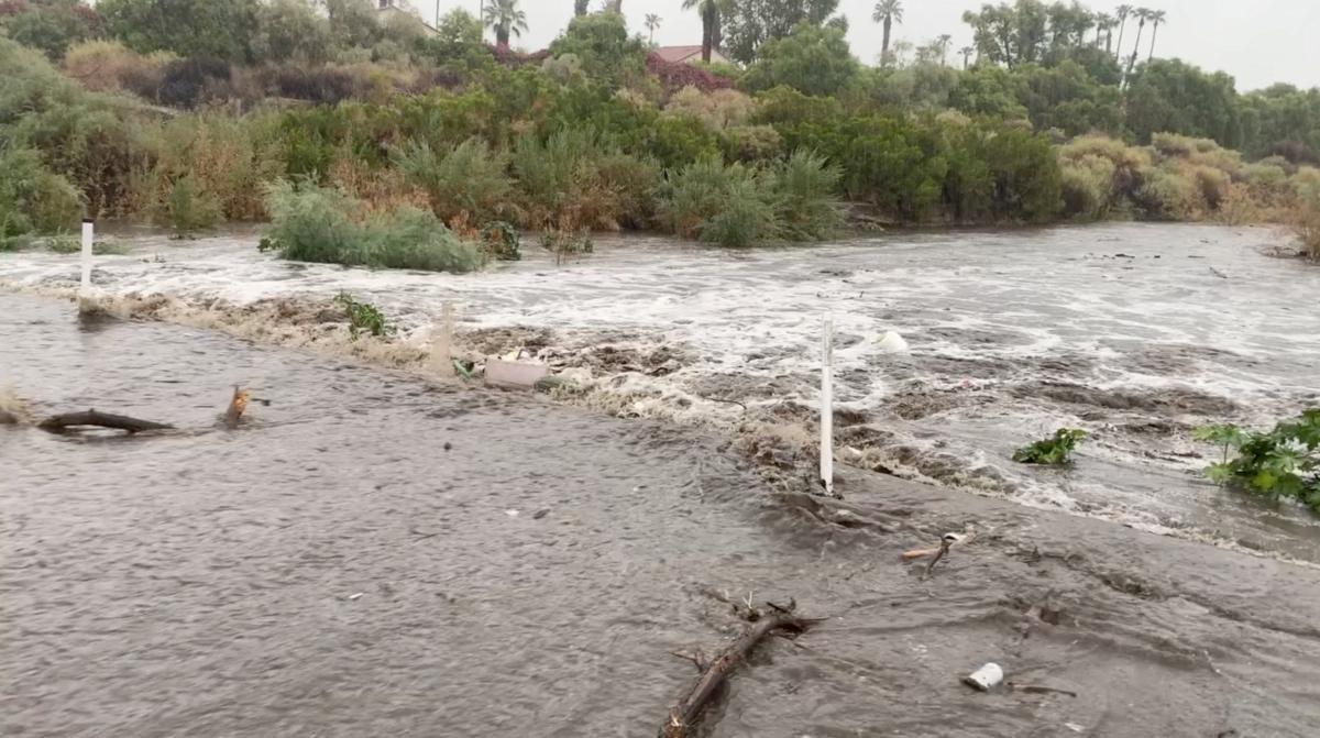 A view shows flood water moving across the road during Tropical Storm Hilary, in Palm Springs, Calif., on Aug. 20, 2023, in this screengrab from a social media video. (Palm Springs Fire Department/Handout via Reuters)