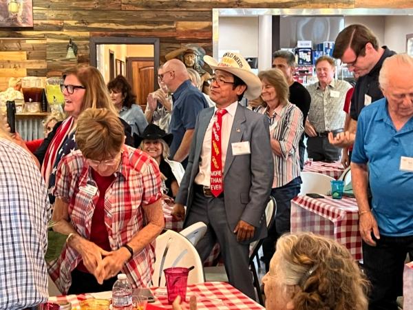 Supporters of former Trump attorney John Eastman listening to his speech at a private event held at a ranch in northern Orange County, Calif., on Aug. 19, 2023. (Brad Jones/The Epoch Times)
