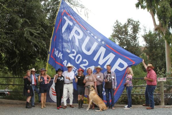 Supporters of former Trump attorney John Eastman pose for a photo at a private event held at a ranch in northern Orange County, Calif., on Aug. 19, 2023. (Brad Jones/The Epoch Times)