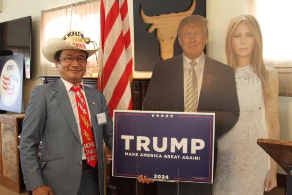 Tien Tran, one of the “front row joes” at Trump rallies, sports a hat, blazer, and tie embroidered with “The World needs Trump more than ever" at a private event held at a ranch in northern Orange County, Calif., on Aug. 19, 2023. (Brad Jones/The Epoch Times)