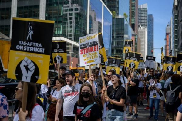 Actors, writers, and other union members join SAG-AFTRA and WGA strikers on a picket line in front of the offices of HBO and Amazon, during the National Union Solidarity Day in New York City on Aug. 22, 2023. (Angela Weiss/AFP via Getty Images)