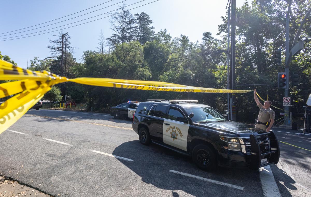 Law enforcement officers block off and investigate the crime scene of a mass shooting at Cooks Corner restaurant in Trabuco Canyon, Calif., on Aug. 24, 2023. (John Fredricks/The Epoch Times)