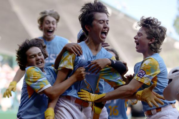 Louis Lappe (19) of the West Region team from El Segundo, California celebrates with teammates after hitting a walk-off home run to defeat the Caribbean Region team from Willemstad, Curacao during the Little League World Series Championship Game at Little League International Complex in South Williamsport, Pa., on Aug. 27, 2023. (Tim Nwachukwu/Getty Images)