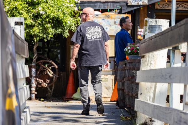 People partake in the reopening of Cook's Corner restaurant and bar, after the a recent mass shooting left three dead and several wounded, in Trabuco Canyon, Calif., on Sept. 1, 2023. (John Fredricks/The Epoch Times)