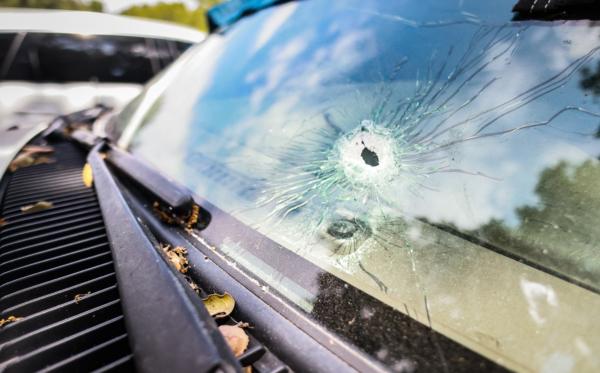 Traces of gunfire remain visible as people partake in the reopening of Cook's Corner restaurant and bar after a recent mass shooting left three dead and several wounded in Trabuco Canyon, Calif., on Sept. 1, 2023. (John Fredricks/The Epoch Times)