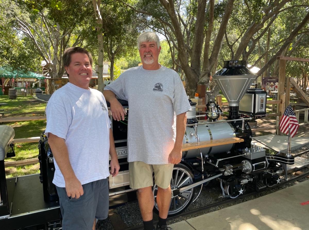 Irvine Park Railroad co-founders John Ford and Steve Horn at Irvine Railroad electric train unveiling in Orange, Calif., on Sept. 7, 2023. (Carol Cassis/The Epoch Times)