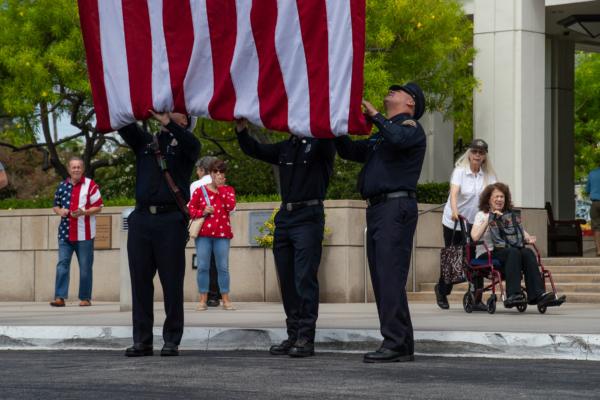 Orange County Fire Authority firefighters fold up the American flag at a ceremony in honor of 9/11 victims at the Nixon Library in Yorba Linda, Calif., on Sept. 11, 2023. (John Fredricks/The Epoch Times)