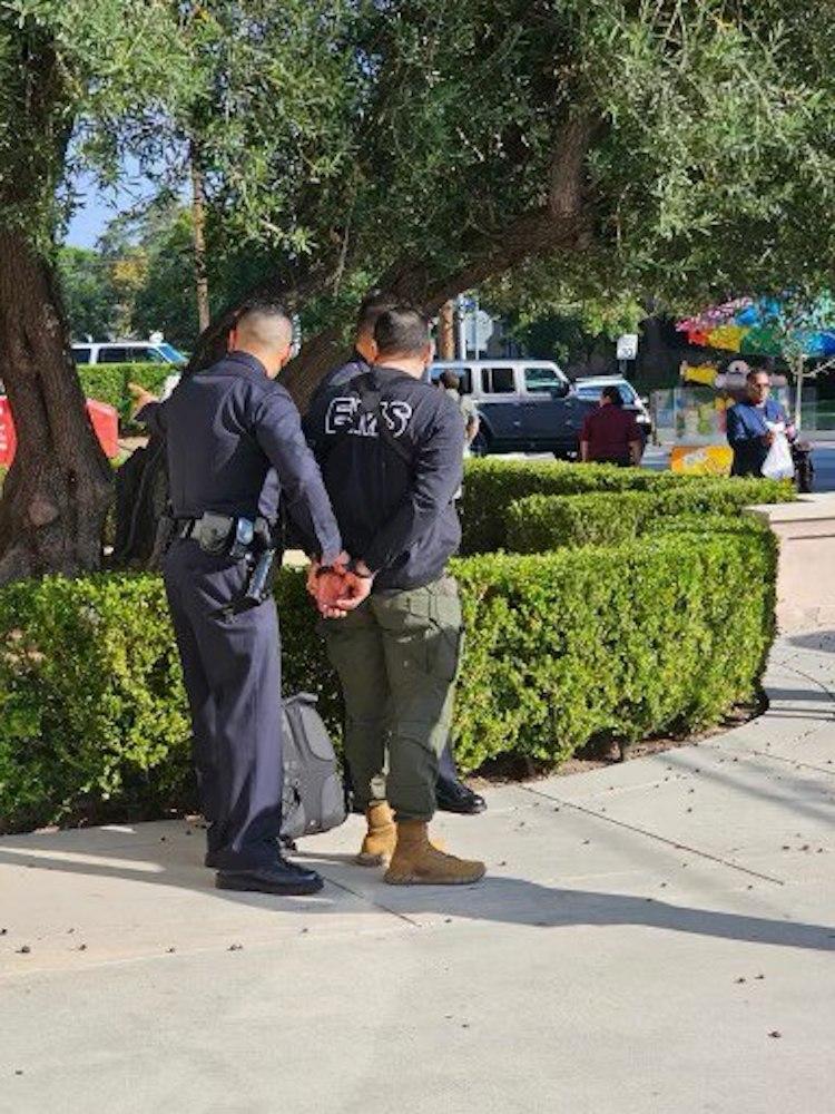 A man is taken into police custody outside an event attended by Democratic presidential candidate Robert F. Kennedy Jr. at Wilshire Ebell Theatre in Los Angeles on Sept. 15, 2023. (Courtesy of Stefanie Spear)